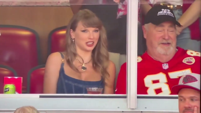 Travis Kelce’s dad, Ed is sitting alongside Taylor Swift for tonight’s season opener game.