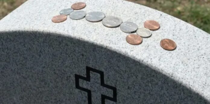 Coins on Gravestone