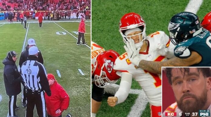 Andy Reid kneeling in front of refs