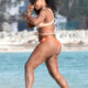 Serena Williams displays voluptuous derriere as she strips down to sexy mismatched bikini...