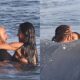 Kim Kardashian and Lewis Hamilton were spotted sharing a passionate kiss in the ocean during a romantic surf date in Malibu...