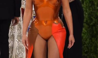Kim Kardashian's tangerine-colored Met Gala look was a true piece of wearable pop art. She wore a custom fiberglass breastplate designed by iconic British artist Allen Jones in collaboration with the design team Whitaker Malem...