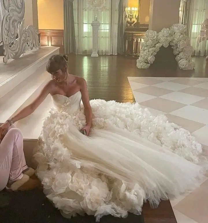 TAYLOR Swift’s custom Dior wedding gown had a ’25ft train’ that left guests speechless before she later surprised everyone by changing into a second look for the reception...